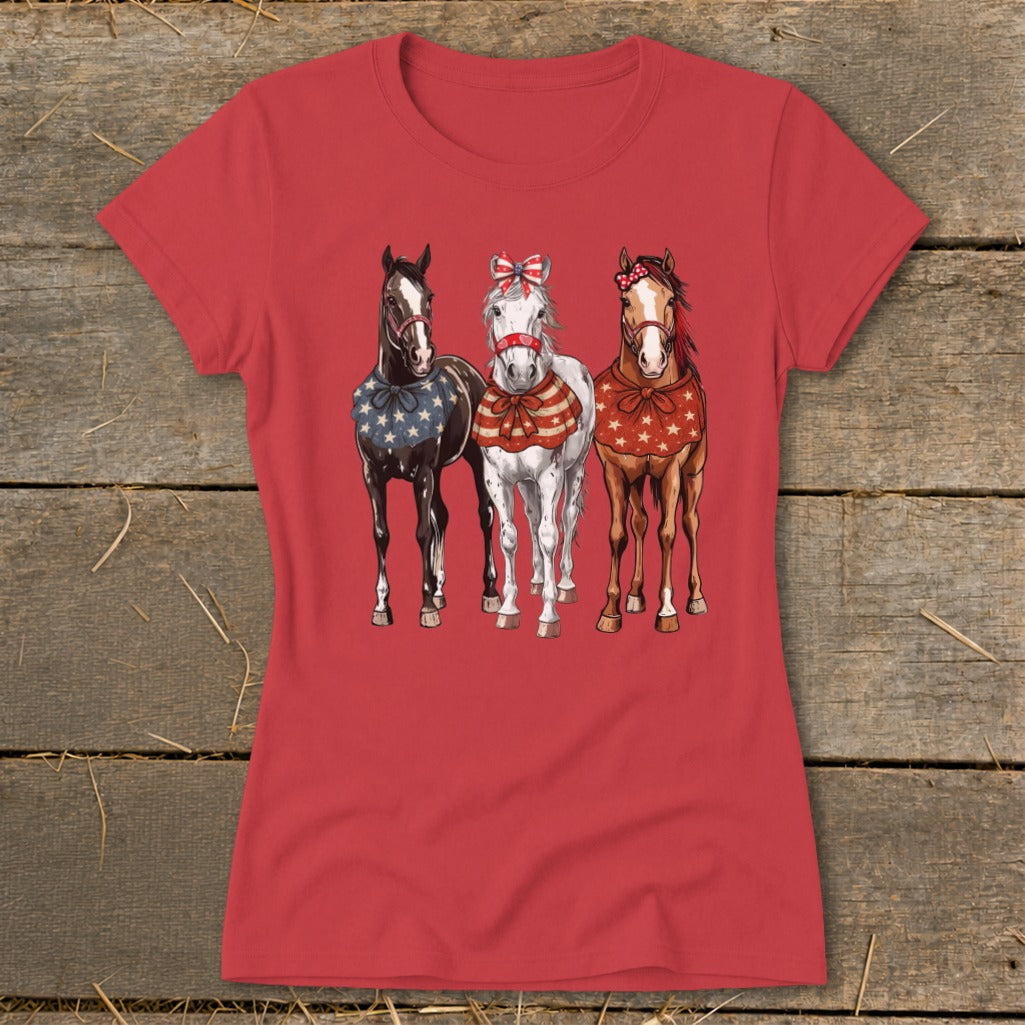 Red t-shirt with three horses wearing patriotic bandanas and bows.
