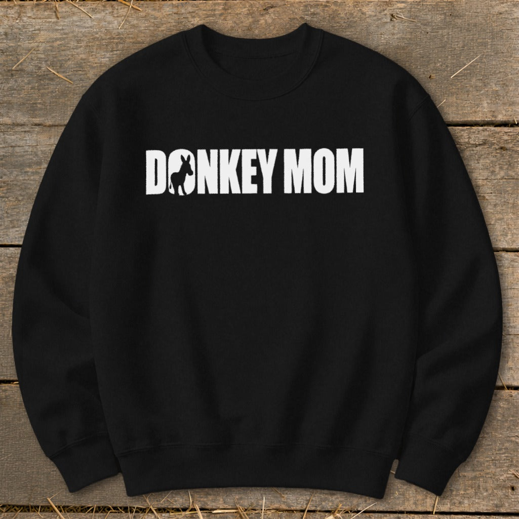 Black crewneck sweatshirt featuring white text that reads DONKEY MOM, with a donkey silhouette inside the letter O.