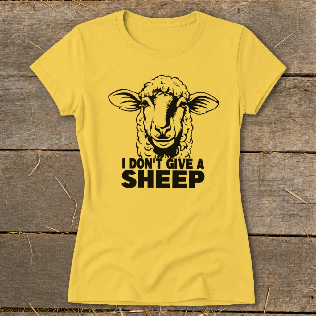 Yellow t-shirt with black graphic of a sheep and text "I DON'T GIVE A SHEEP".