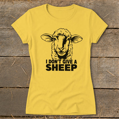 Yellow t-shirt with black graphic of a sheep and text "I DON'T GIVE A SHEEP".