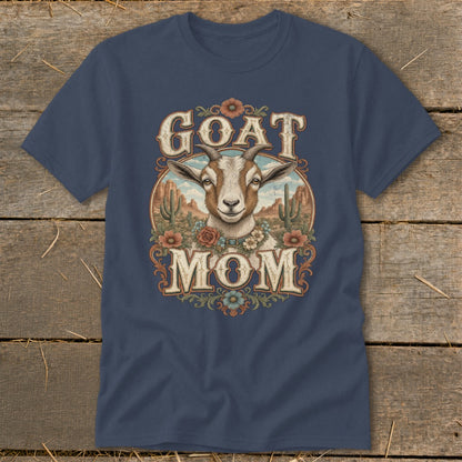 Goat Mom graphic on navy blue t-shirt with desert landscape background.