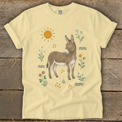 Light yellow t-shirt with a watercolor donkey and floral design.