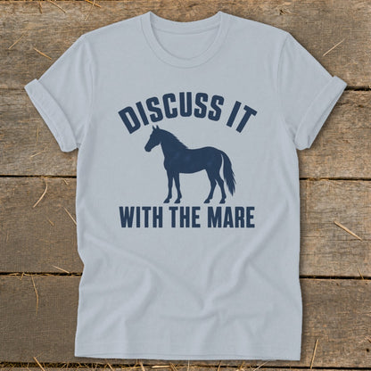 Light blue t-shirt with dark blue text and horse silhouette reading "Discuss It With The Mare".