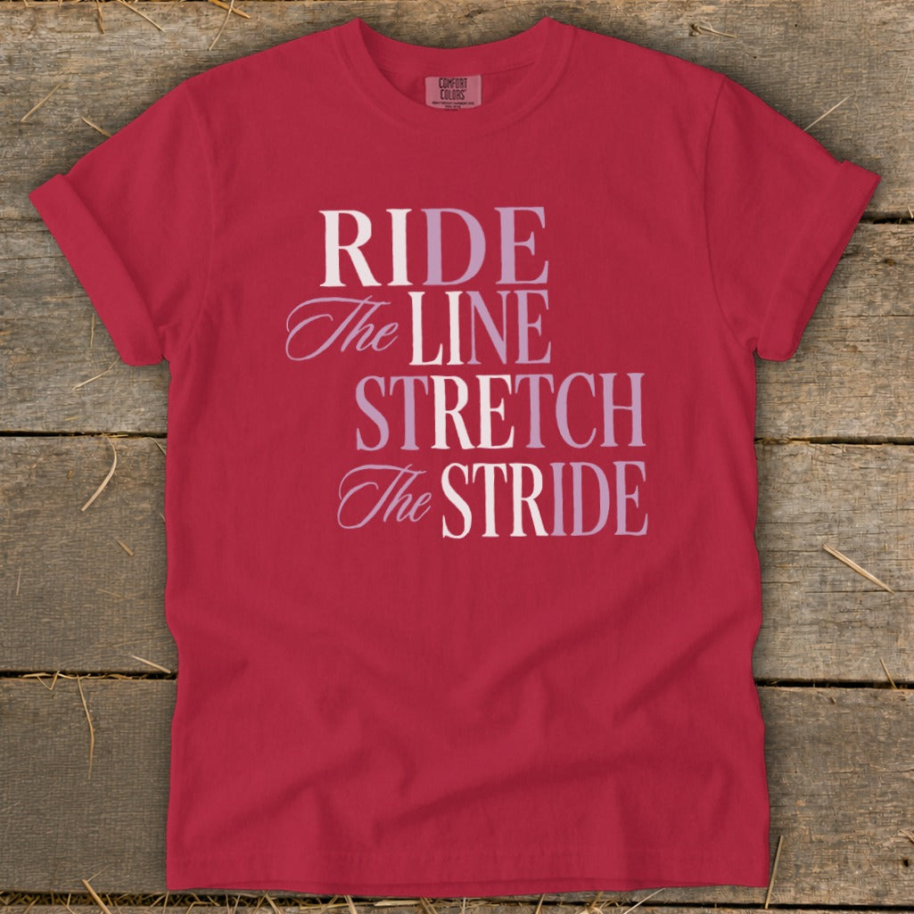 Red t-shirt with "RIDE The LINE STRETCH The STRIDE" text.
