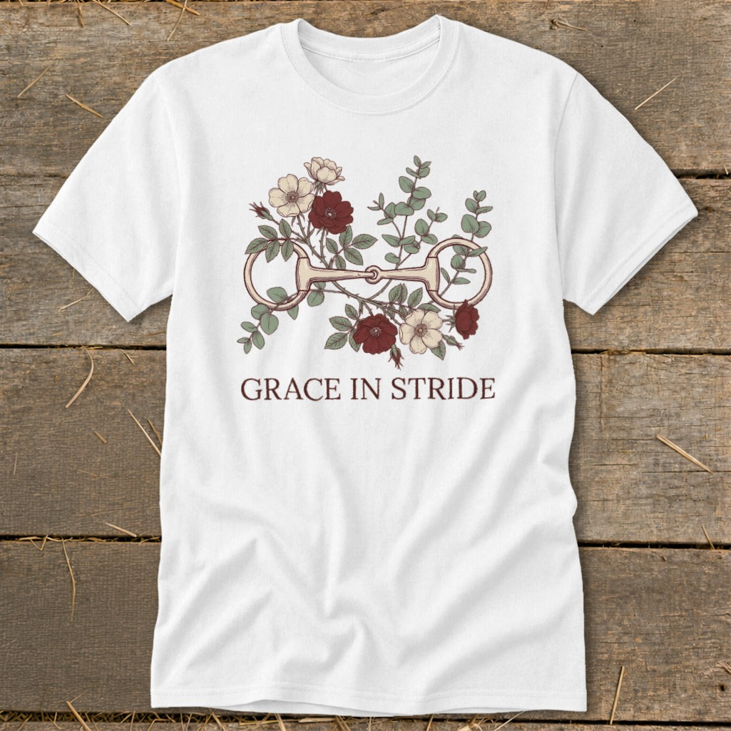 White t-shirt with floral horse bit design and text "GRACE IN STRIDE".
