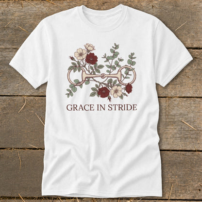 White t-shirt with floral horse bit design and text "GRACE IN STRIDE".