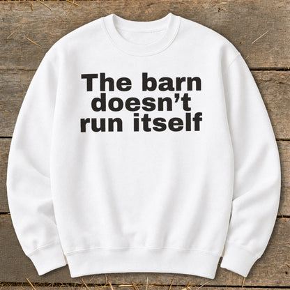 White sweatshirt with black text "The barn doesn't run itself"