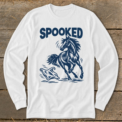 White long-sleeve shirt with "SPOOKED" text and a startled horse running from a ghost.