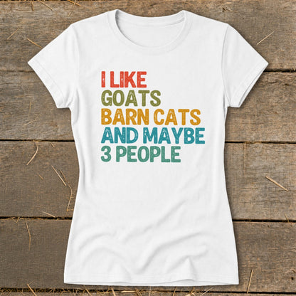 White t-shirt with text "I LIKE GOATS BARN CATS AND MAYBE 3 PEOPLE" in retro colors.