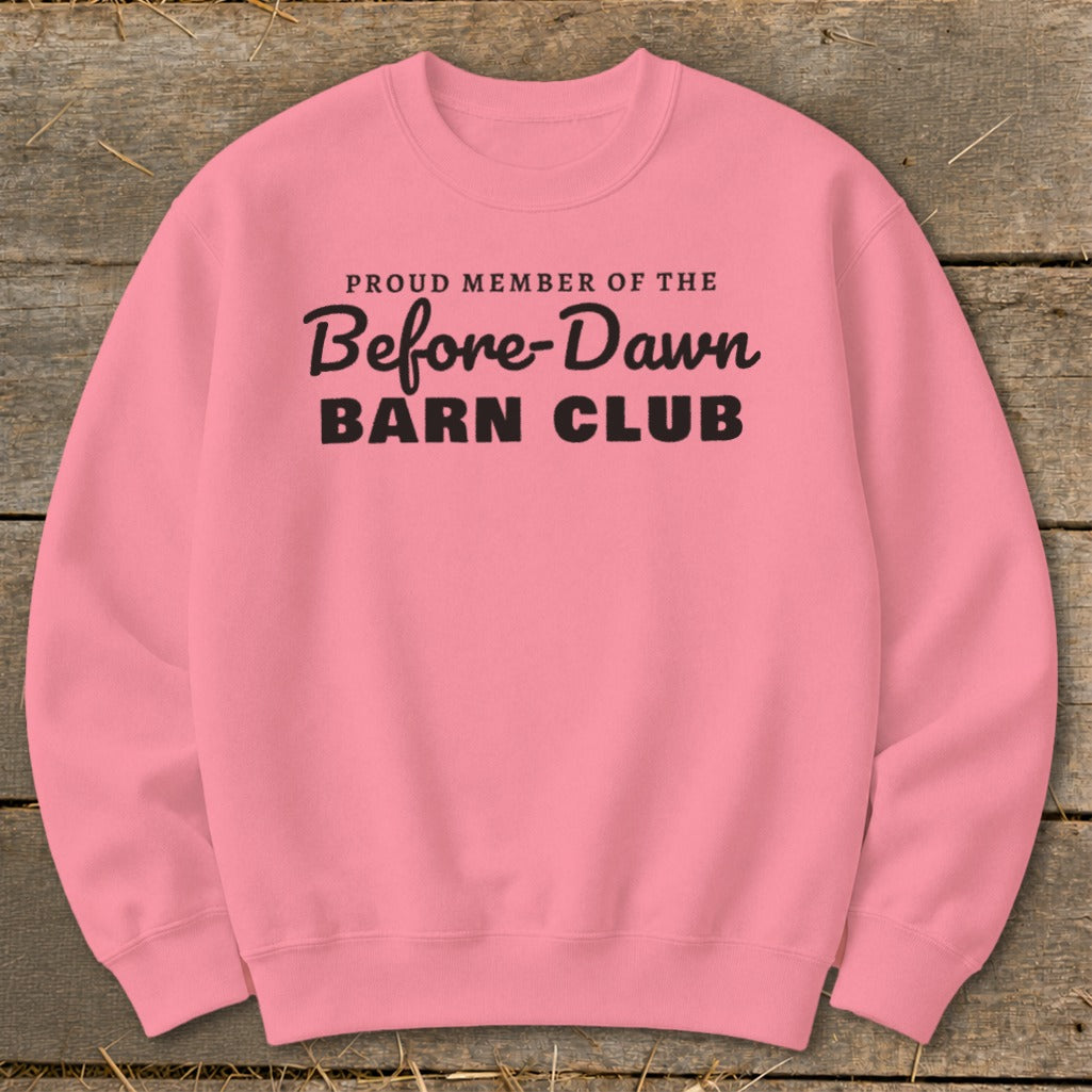 Pink crewneck sweatshirt with black text reading "Proud Member of the Before-Dawn Barn Club."