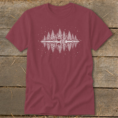 Maroon t-shirt with white reflection of pine trees and a deer silhouette graphic.