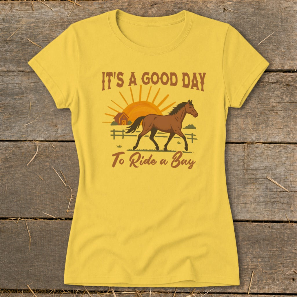 Yellow t-shirt with "It's a good day to ride a bay" and horse graphic.