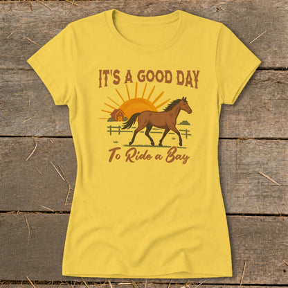 Yellow t-shirt with "It's a good day to ride a bay" and horse graphic.