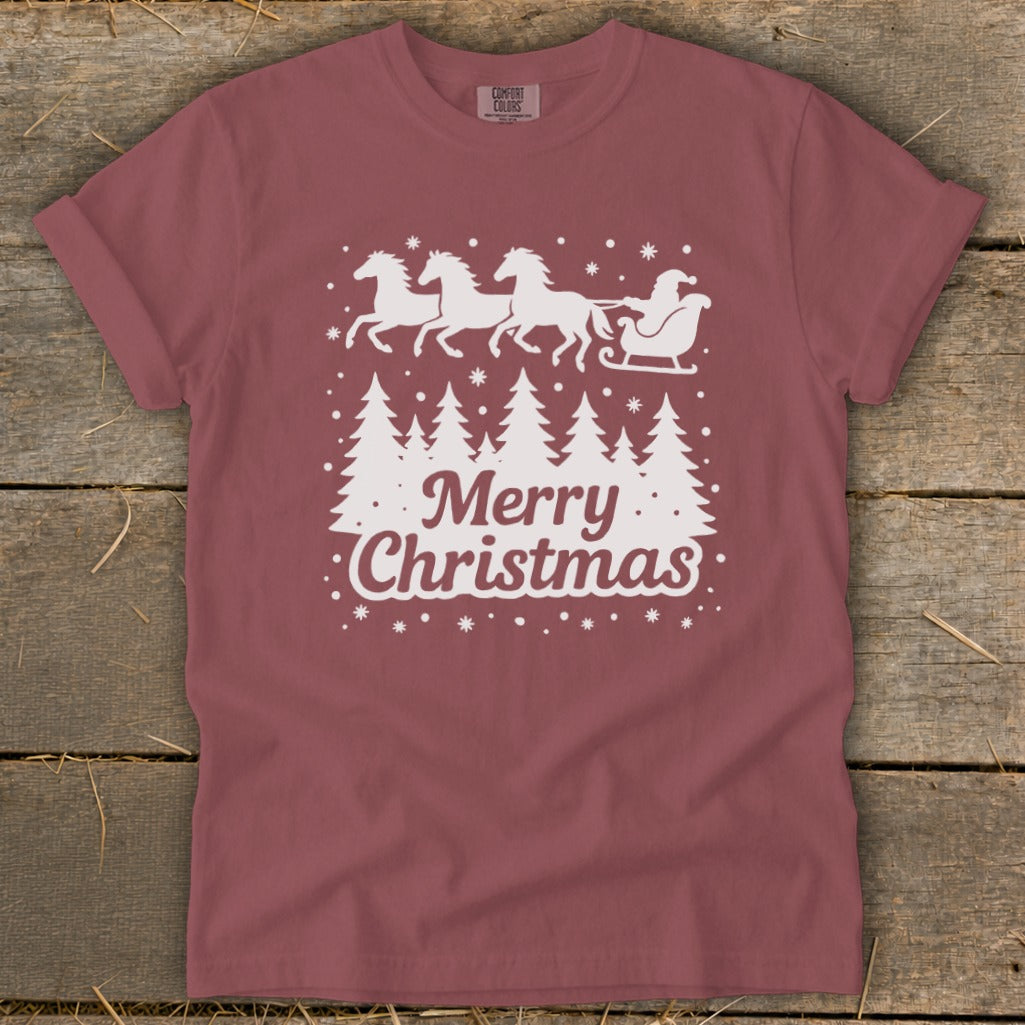 Maroon t-shirt with white Christmas trees, horses, and Santa in a sleigh with "Merry Christmas" text.