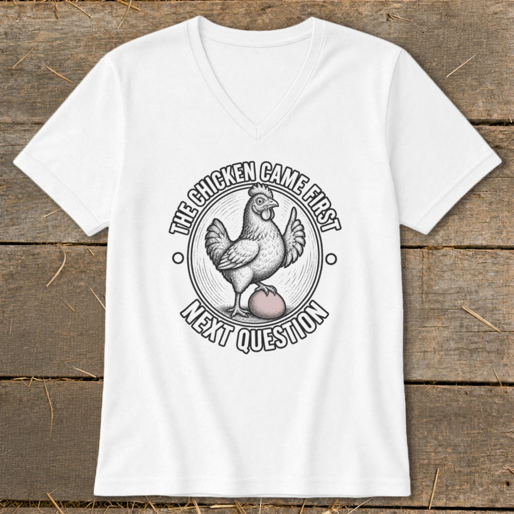 White t-shirt with circular graphic of chicken on egg, saying "The Chicken Came First Next Question".