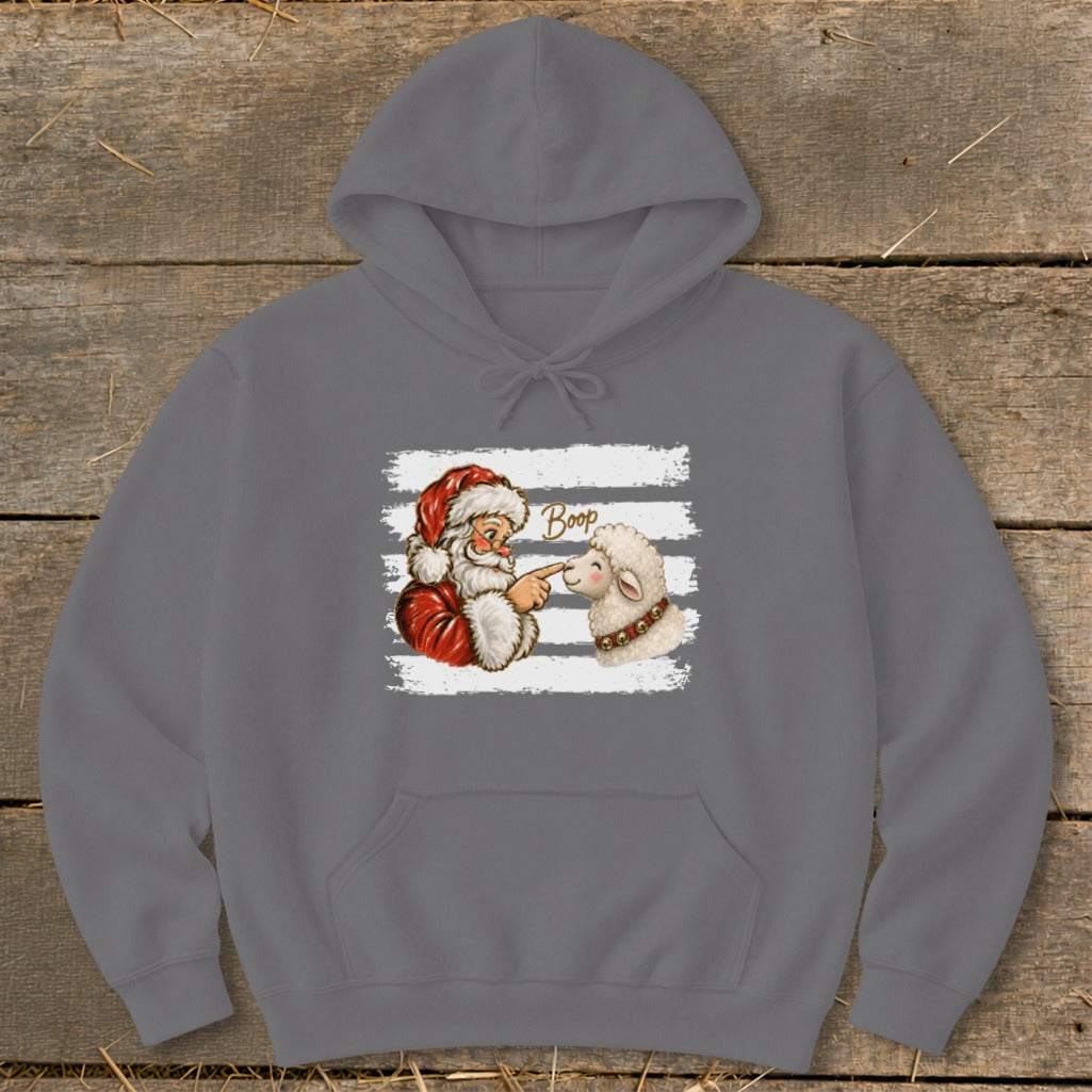 Santa touching sheep's nose with finger, text "Boop" on gray hoodie.