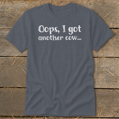 Gray t-shirt with white text that reads "Oops, I got another cow..."