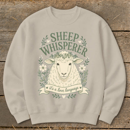Light gray sweatshirt with sheep graphic and text "Sheep Whisperer, it's a love language".