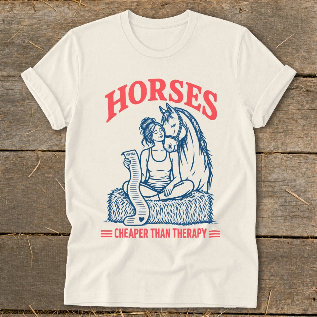 Graphic tee with "Horses" and "Cheaper Than Therapy" text, featuring a woman and horse.