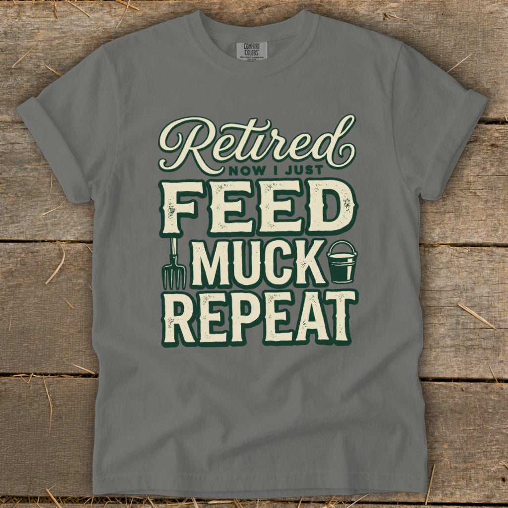 Grey t-shirt with "Retired Now I Just Feed Muck Repeat" graphic.