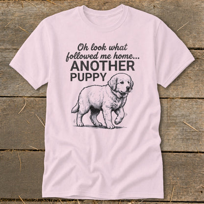 Light pink t-shirt with black text "Oh look what followed me home... ANOTHER PUPPY" and a puppy illustration.