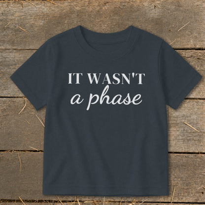 Dark grey t-shirt with white text "IT WASN'T a phase".
