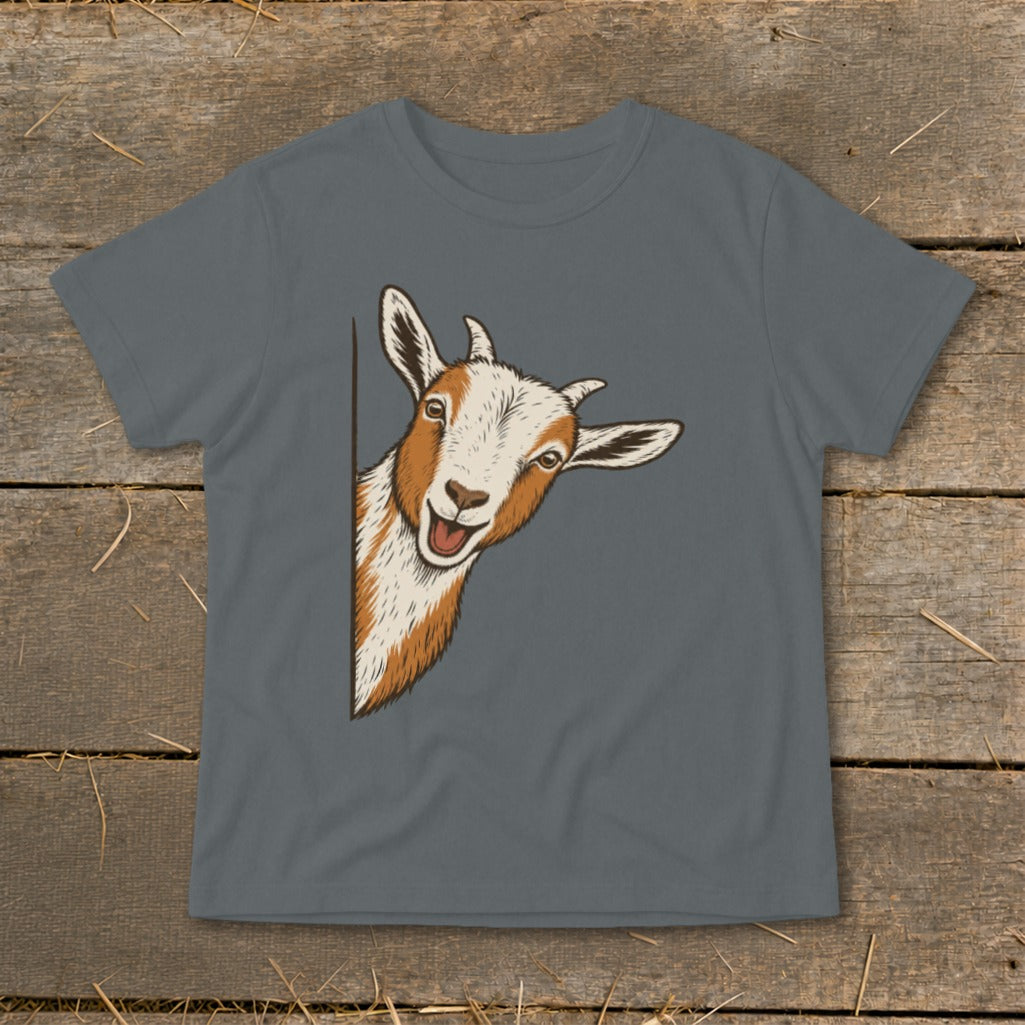 Illustration of a smiling goat peeking from behind a dark gray t-shirt.