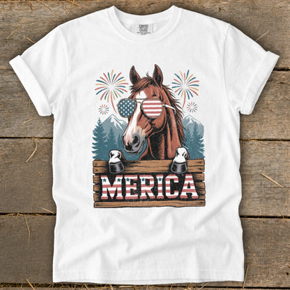 Horse wearing American flag sunglasses with "MERICA" text and fireworks.