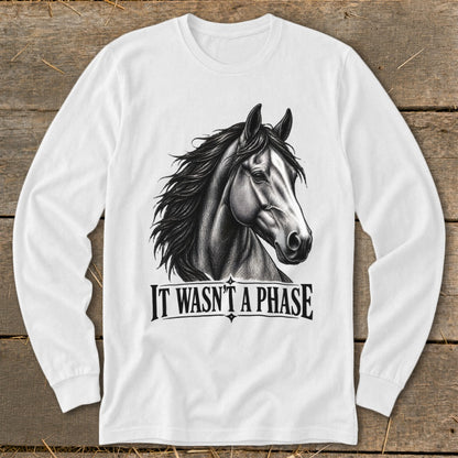 White long-sleeve shirt with a detailed horse illustration and text "IT WASN'T A PHASE".