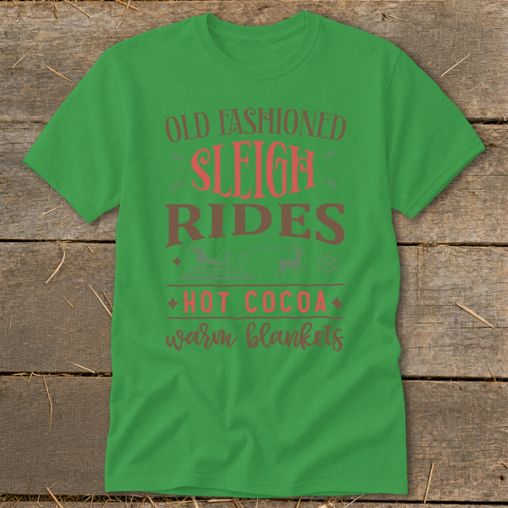 Green t-shirt with "Old Fashioned Sleigh Rides Hot Cocoa Warm Blankets" text.