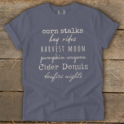 Comfort Colors t-shirt with text: corn stalks, hay rides, harvest moon, pumpkin wagons, cider donuts, bonfire nights.