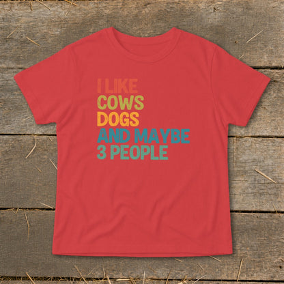 Red t-shirt with text "I LIKE COWS DOGS AND MAYBE 3 PEOPLE"