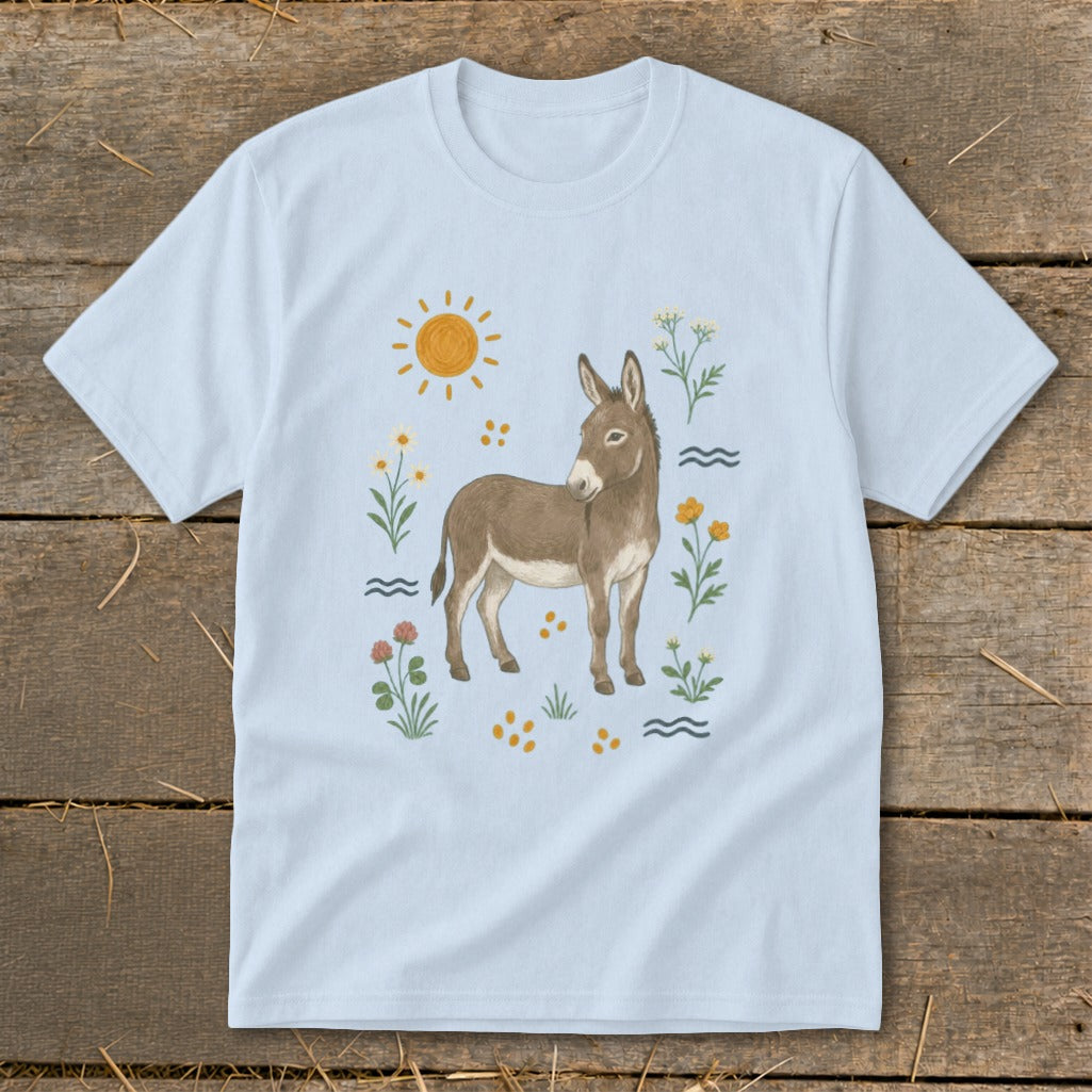 Light blue t-shirt with a watercolor-style donkey illustration surrounded by flowers and sun.