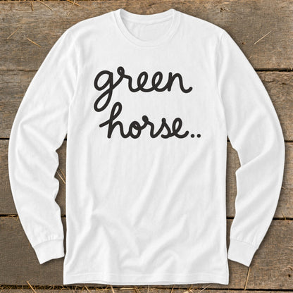 White long sleeve shirt with "green horse..." text in black script.