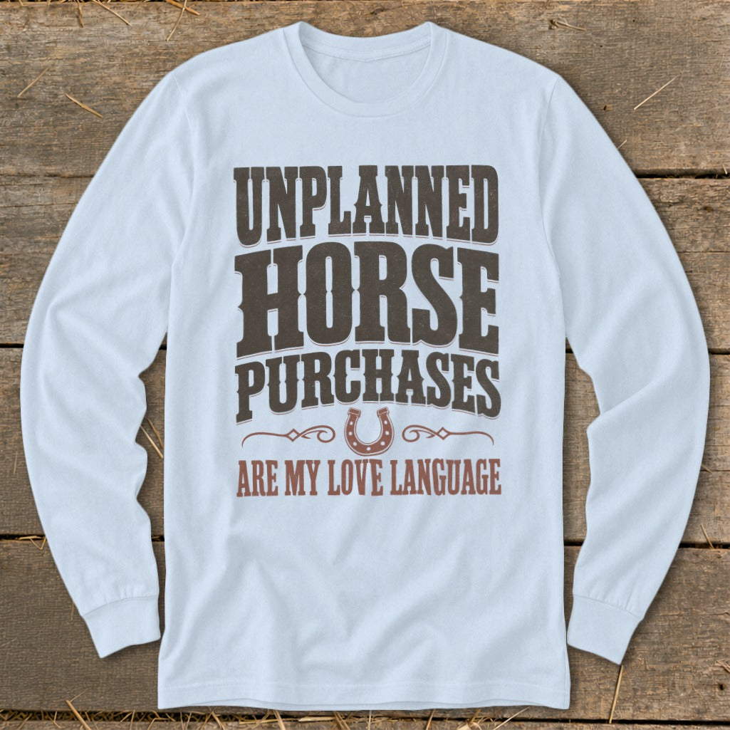 White long sleeve shirt with "Unplanned Horse Purchases Are My Love Language" text.