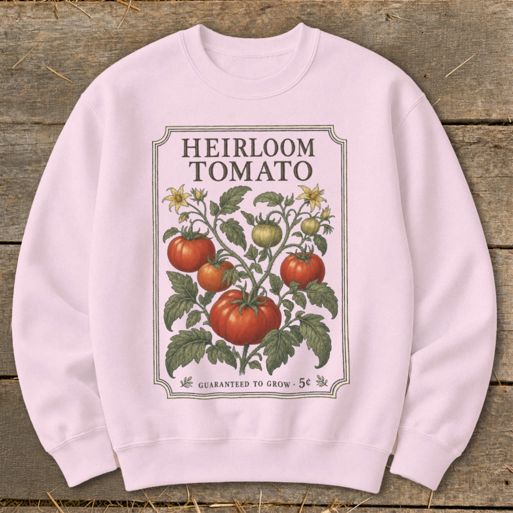 Pink sweatshirt with "Heirloom Tomato" print of tomato plant and seed packet details.