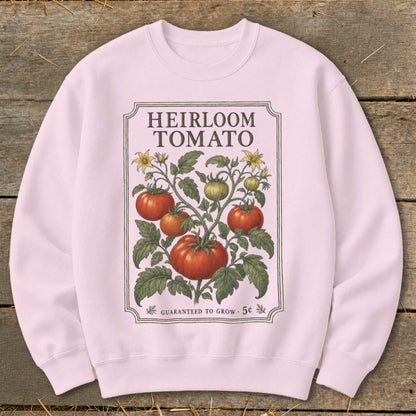 Pink sweatshirt with "Heirloom Tomato" print of tomato plant and seed packet details.