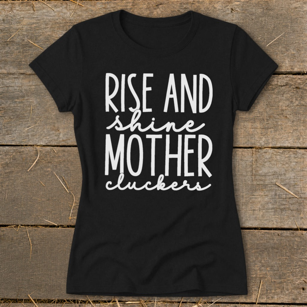 Black t-shirt with "Rise and shine mother cluckers" white text.