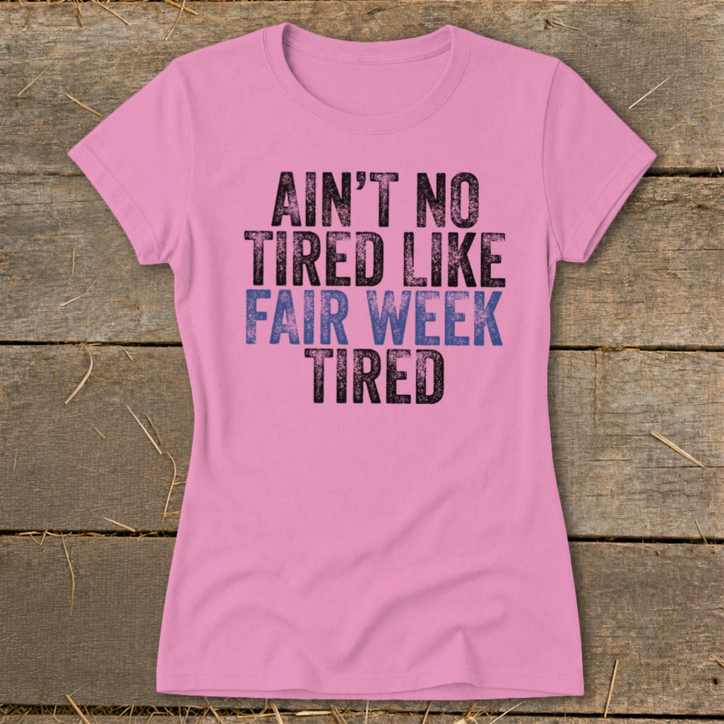 Pink t-shirt with text "Ain't No Tired Like Fair Week Tired."