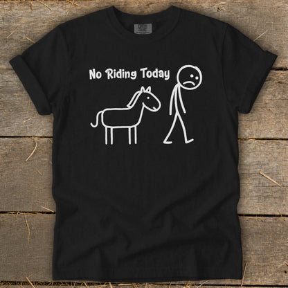 Black t-shirt with white text "No Riding Today" and stick figures of a horse and sad person.