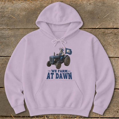 Light purple hoodie with a goat driving a blue tractor and the text "We Farm at Dawn".