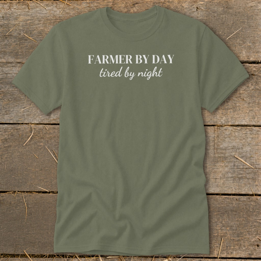 Olive green t-shirt with white text reading "FARMER BY DAY tired by night".