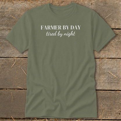 Olive green t-shirt with white text reading "FARMER BY DAY tired by night".