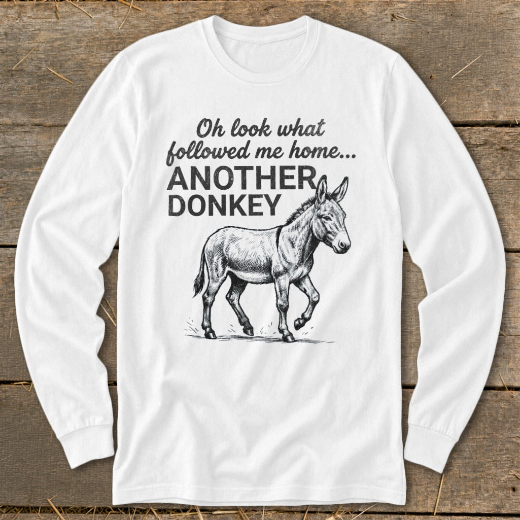 White long sleeve shirt with a donkey illustration and text "Oh look what followed me home... ANOTHER DONKEY".