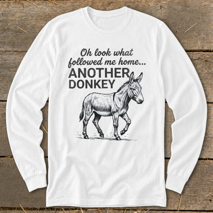 White long sleeve shirt with a donkey illustration and text "Oh look what followed me home... ANOTHER DONKEY".