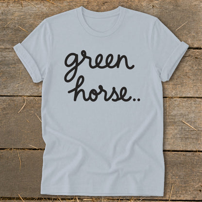Light blue t-shirt with black script text "green horse..".