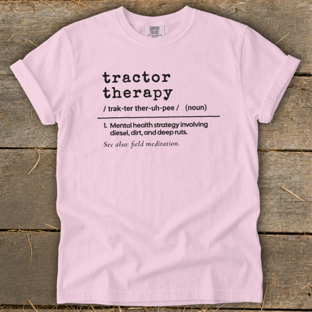Pink t-shirt with "tractor therapy" definition and "field meditation" reference.