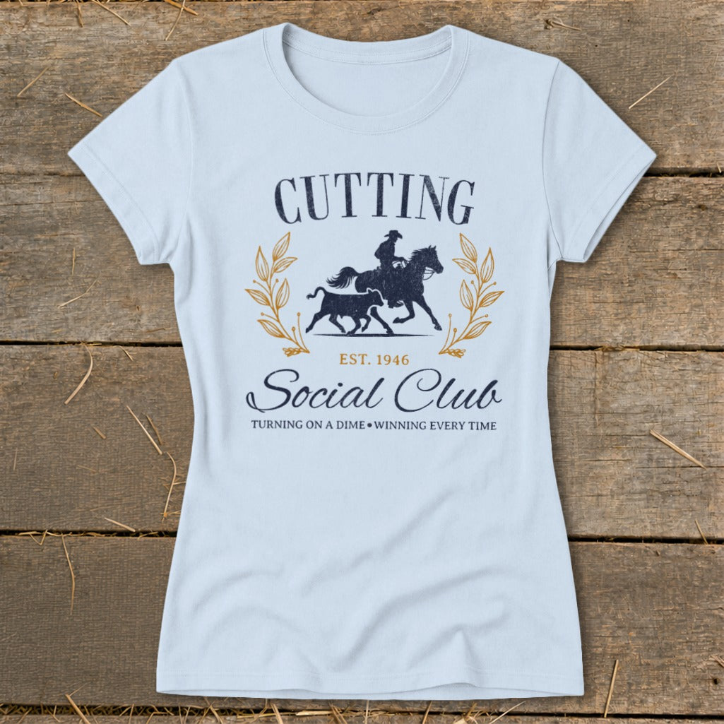 Light blue t-shirt with "Cutting Social Club" and equestrian graphic.
