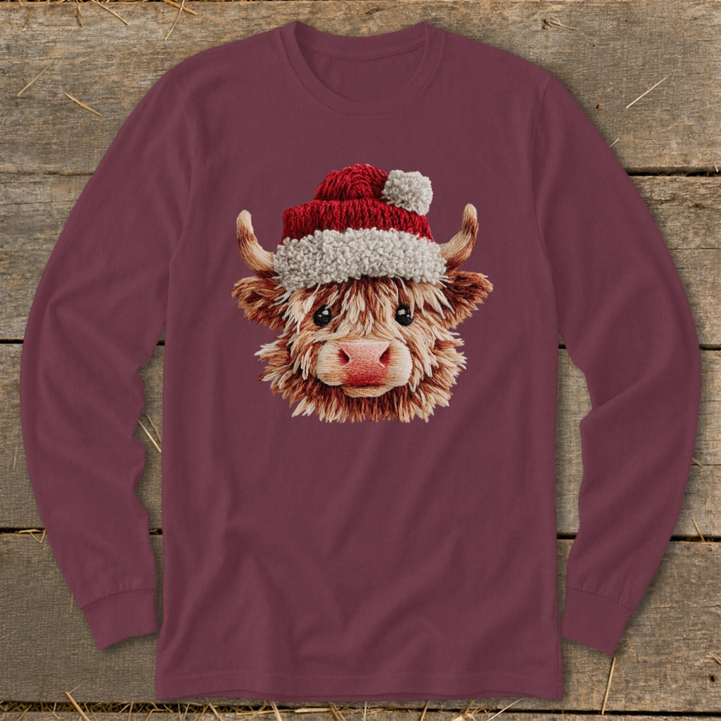 Maroon long-sleeve shirt with a Highland cow wearing a Santa hat graphic.
