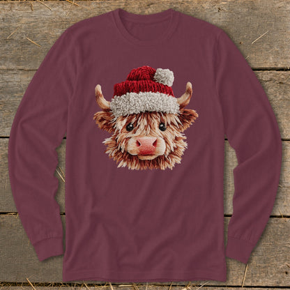 Maroon long-sleeve shirt with a Highland cow wearing a Santa hat graphic.